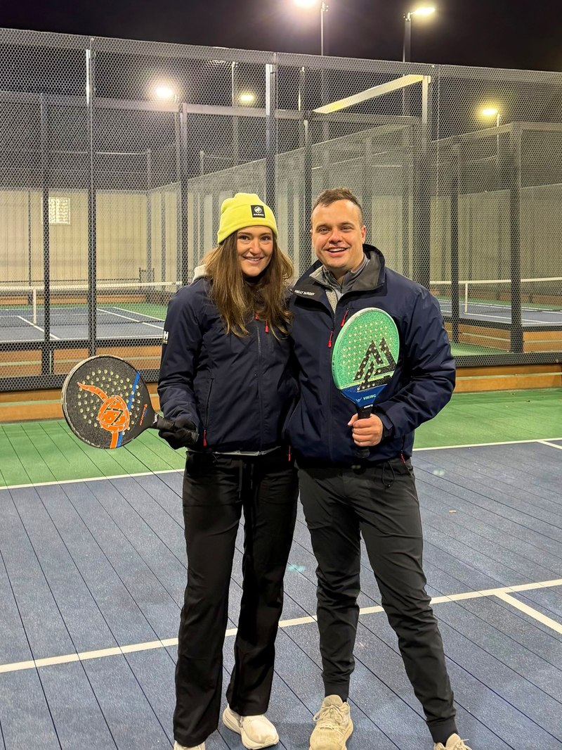 Will and Callie on a paddle tennis court